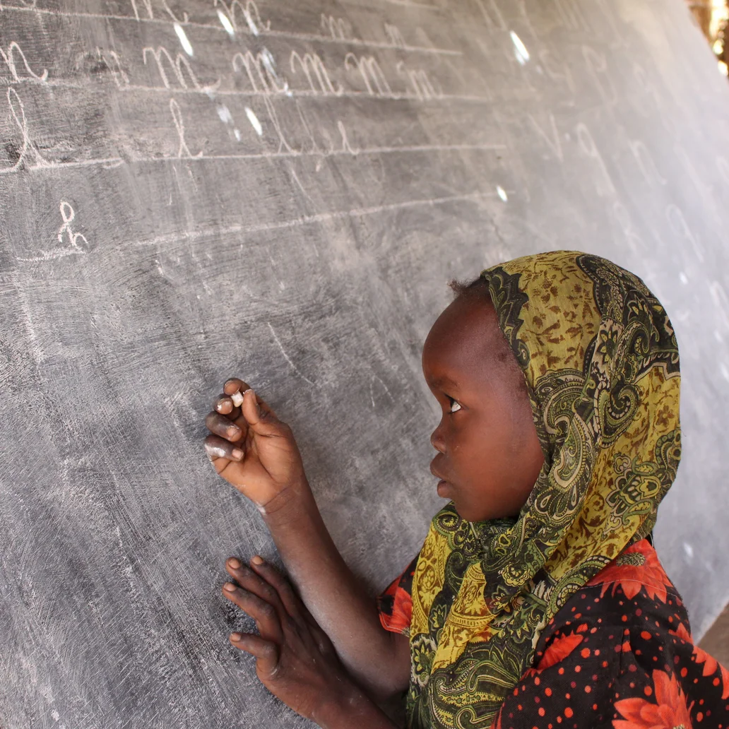 kids writing on the board